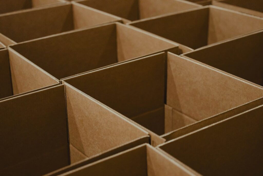 Cardboard dividers forming a grid of packing compartments