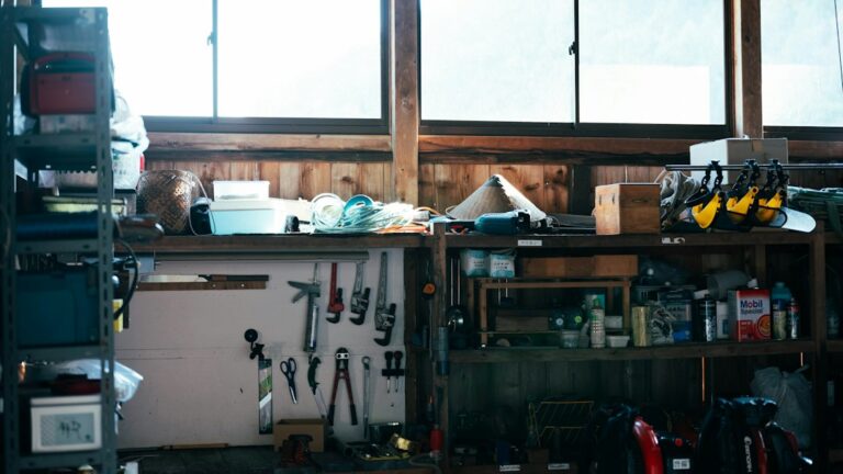 Tools, containers, and supplies arranged on workshop shelves