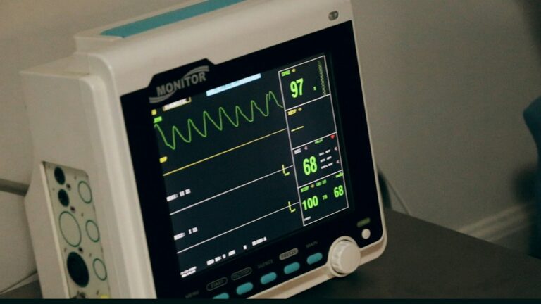A hospital vital-sign monitor displaying waveforms