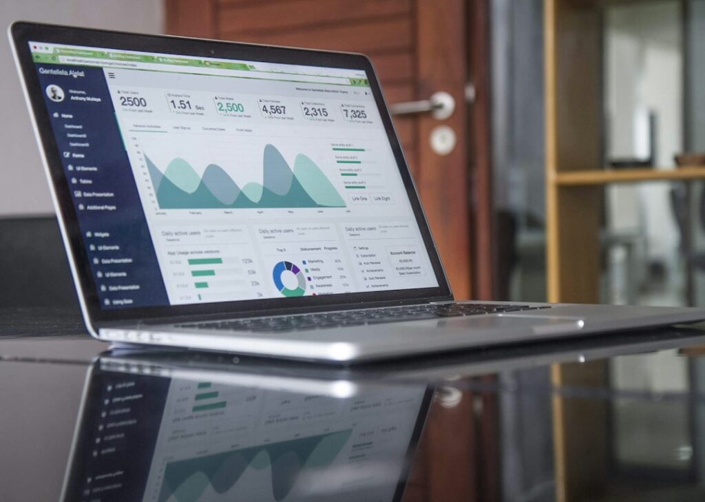 Laptop displaying charts and an analytics dashboard.