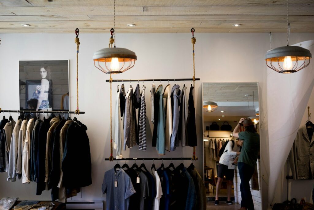 Clothing racks and a mirror inside a boutique