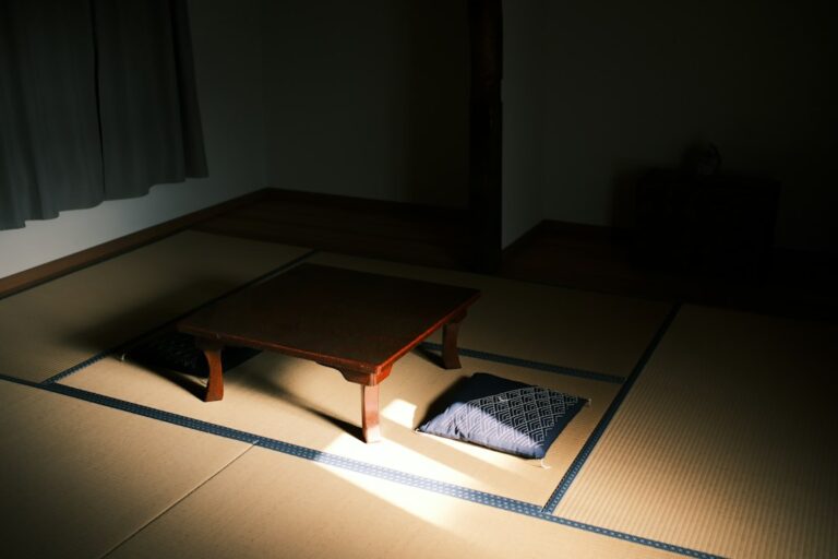 Floor cushions beside a low wooden table in a quiet room