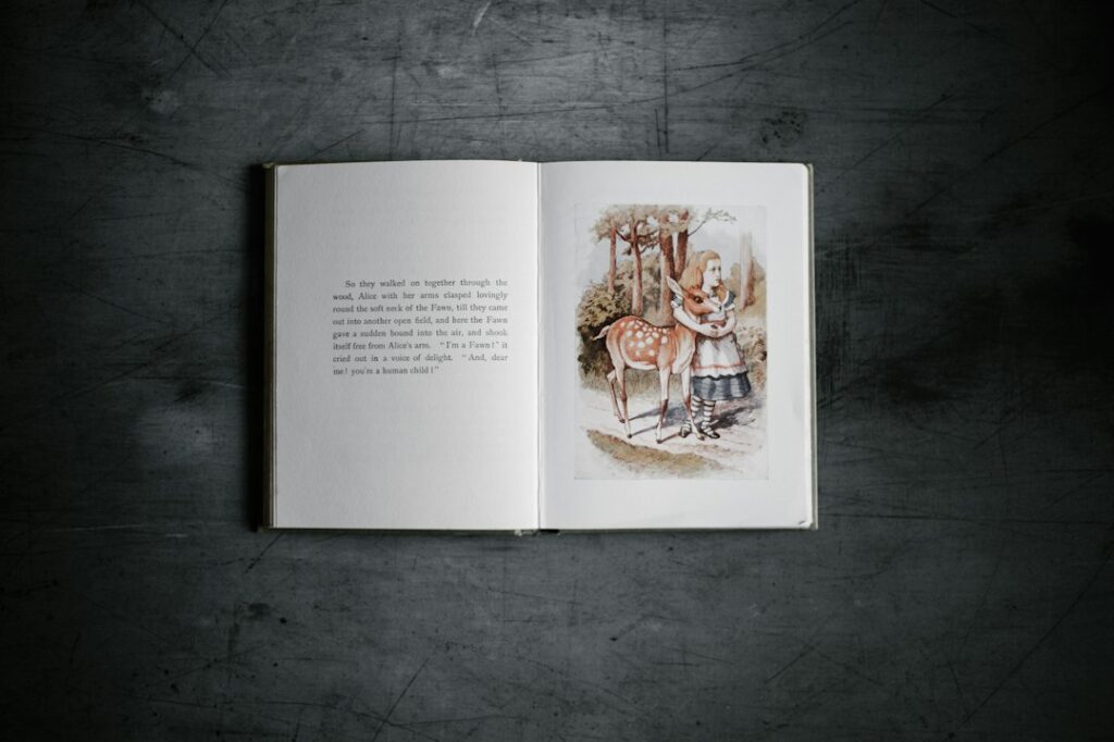 Open illustrated book showing a girl and a deer on the right-hand page