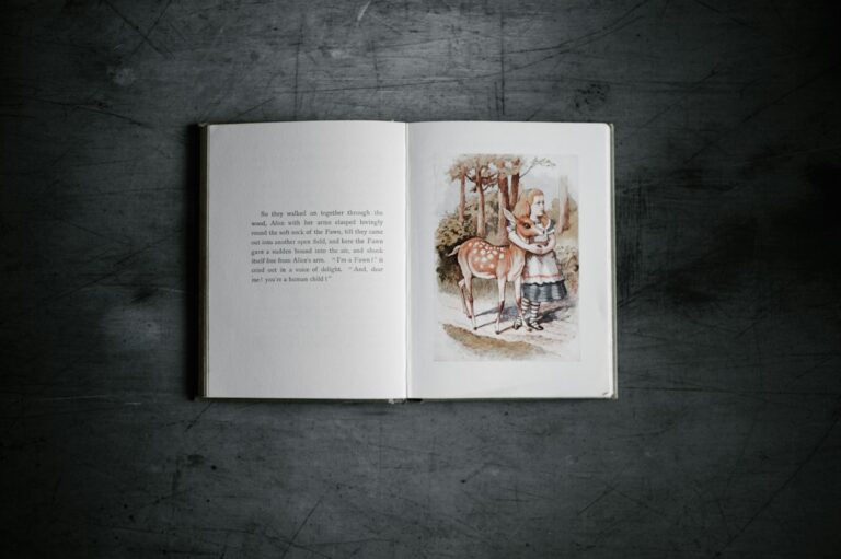 Open illustrated book showing a girl and a deer on the right-hand page