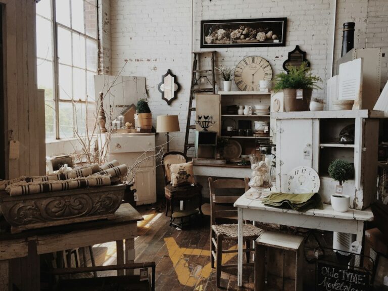 Vintage furniture, clocks and household objects displayed in a shop