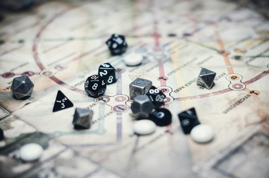 Polyhedral dice and counters on a printed map
