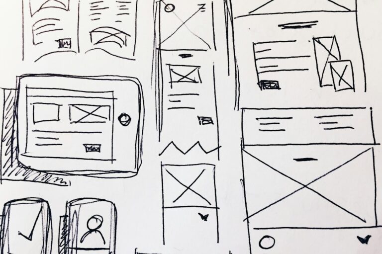 Hand-drawn wireframe sketches for web and mobile screens.