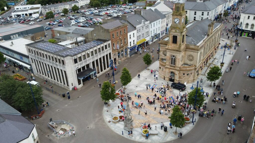 Aerial view of Coleraine Town Hall and people in the surrounding square